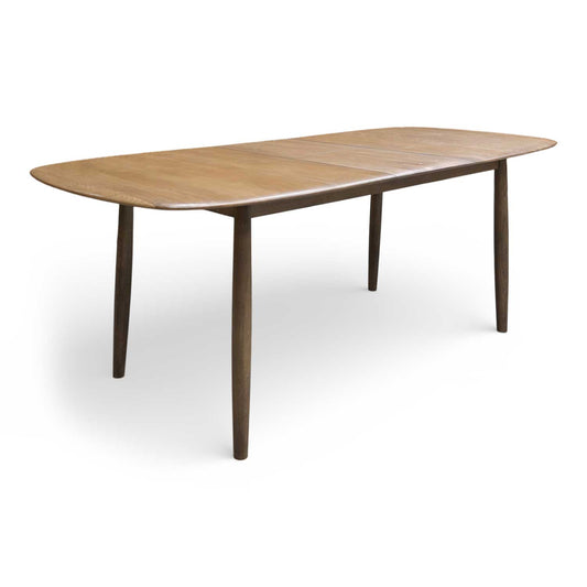 Full view of the ‘Stockholm’ dark oak solid oak 160cm extending dining table with rounded edges.