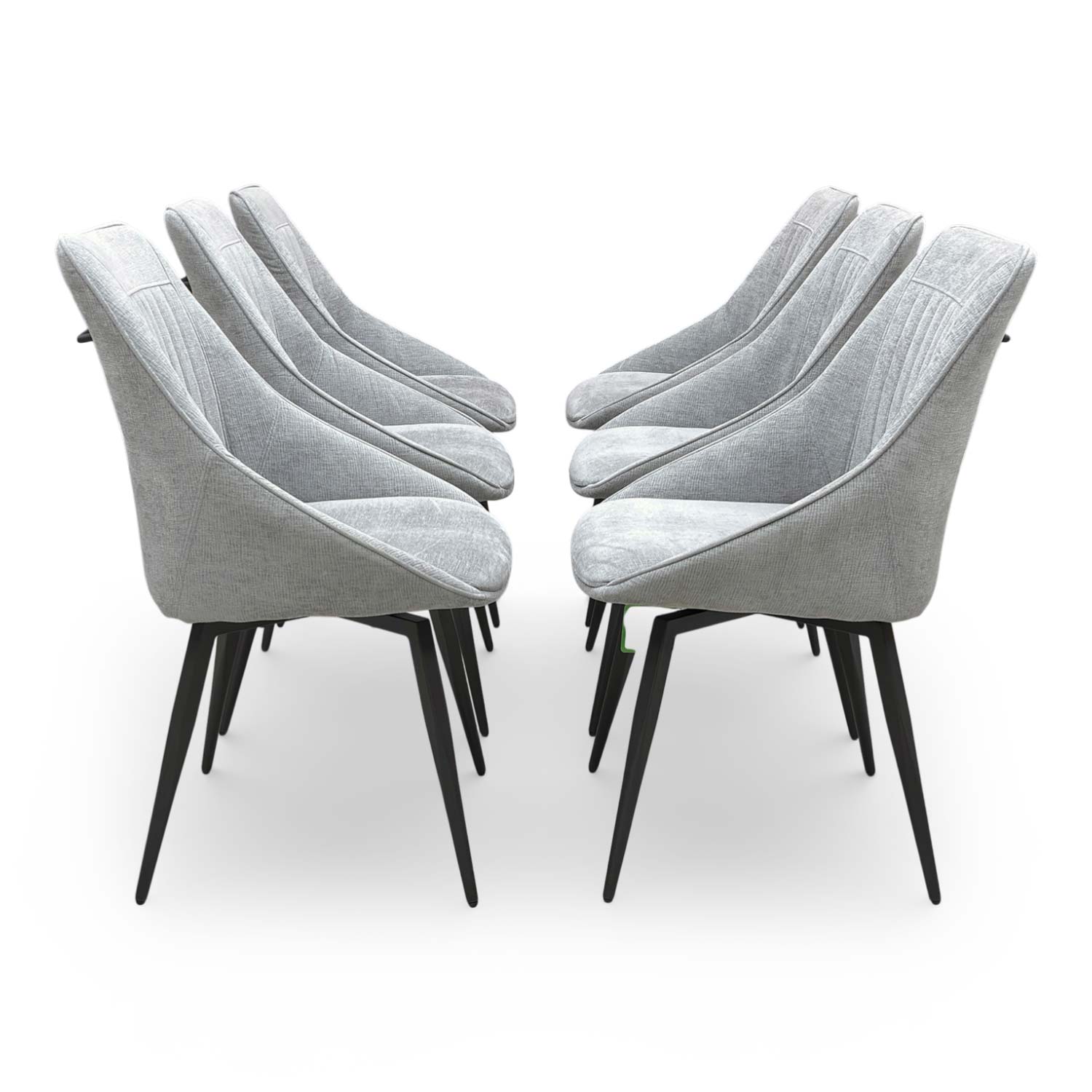 Side view of the ‘Crete’ dining chair showing the slender matt black metal legs and modern profile.