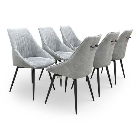 Full view of the ‘Crete’ silver fabric swivel dining chairs set of 6 with curved fluted backs.