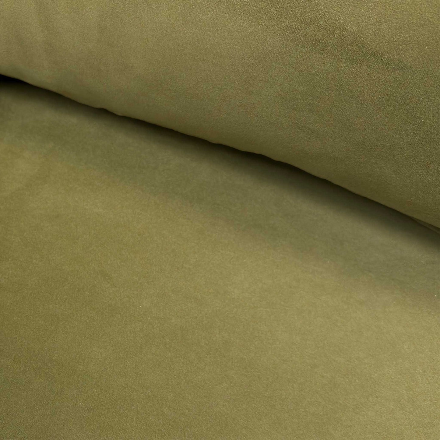 Close-up of the sumptuous olive green plush velvet fabric and high-quality upholstery stitching.