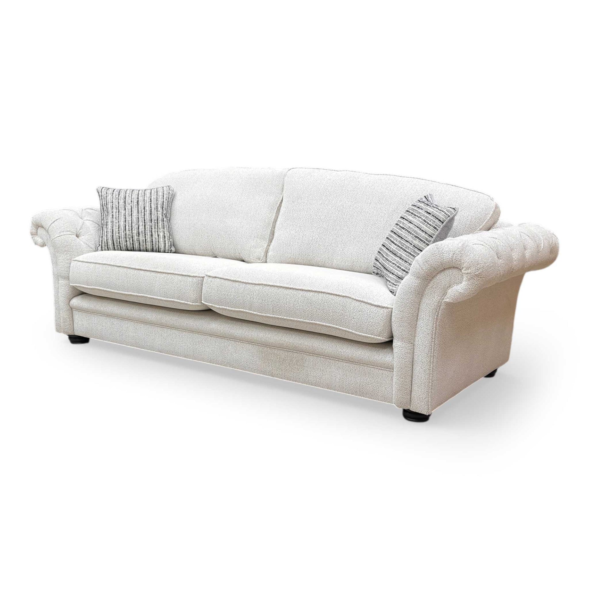 Side profile of the ‘Vincent’ sofa, showing the clean lines of the armrests and supportive back cushions.