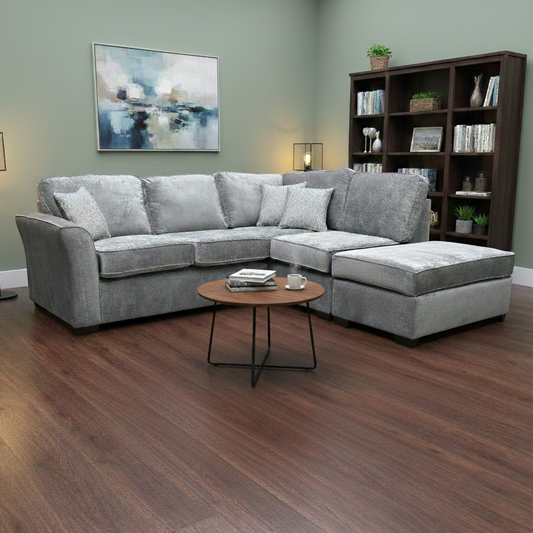 Living Room shot showing the spacious chaise extension and formal back design of the ‘Veronica’ grey sofa.