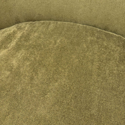 Close-up of the high-quality sage green fabric and durable upholstery stitching on the ‘Terry’ chair.