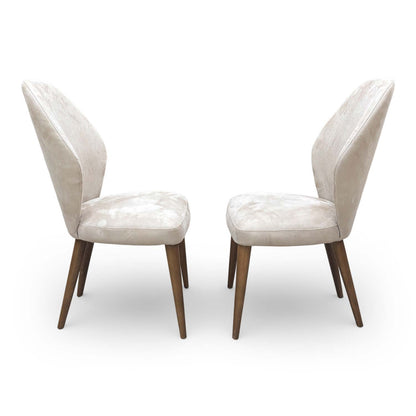 Side profile view of the Emperor R066 chair showing the sleek vertical silhouette and tapered legs.