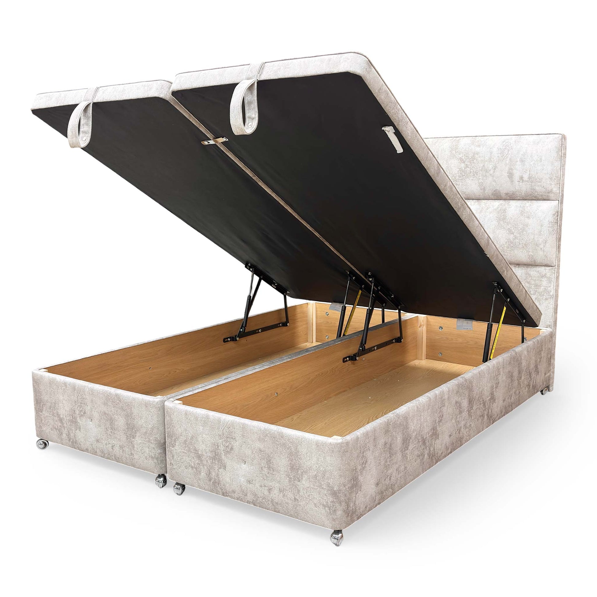 Internal view of the ottoman base in the open position, demonstrating the spacious under-bed storage and end-lift mechanism.