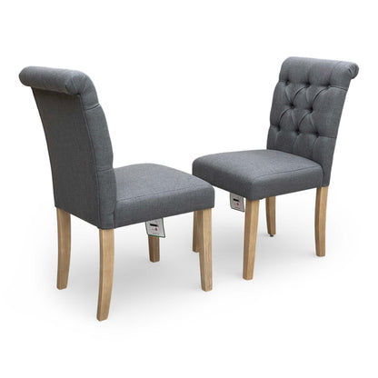 Rear angle view of the ‘Lewis’ dining chair showing the uniform fabric coverage and fixed back construction.