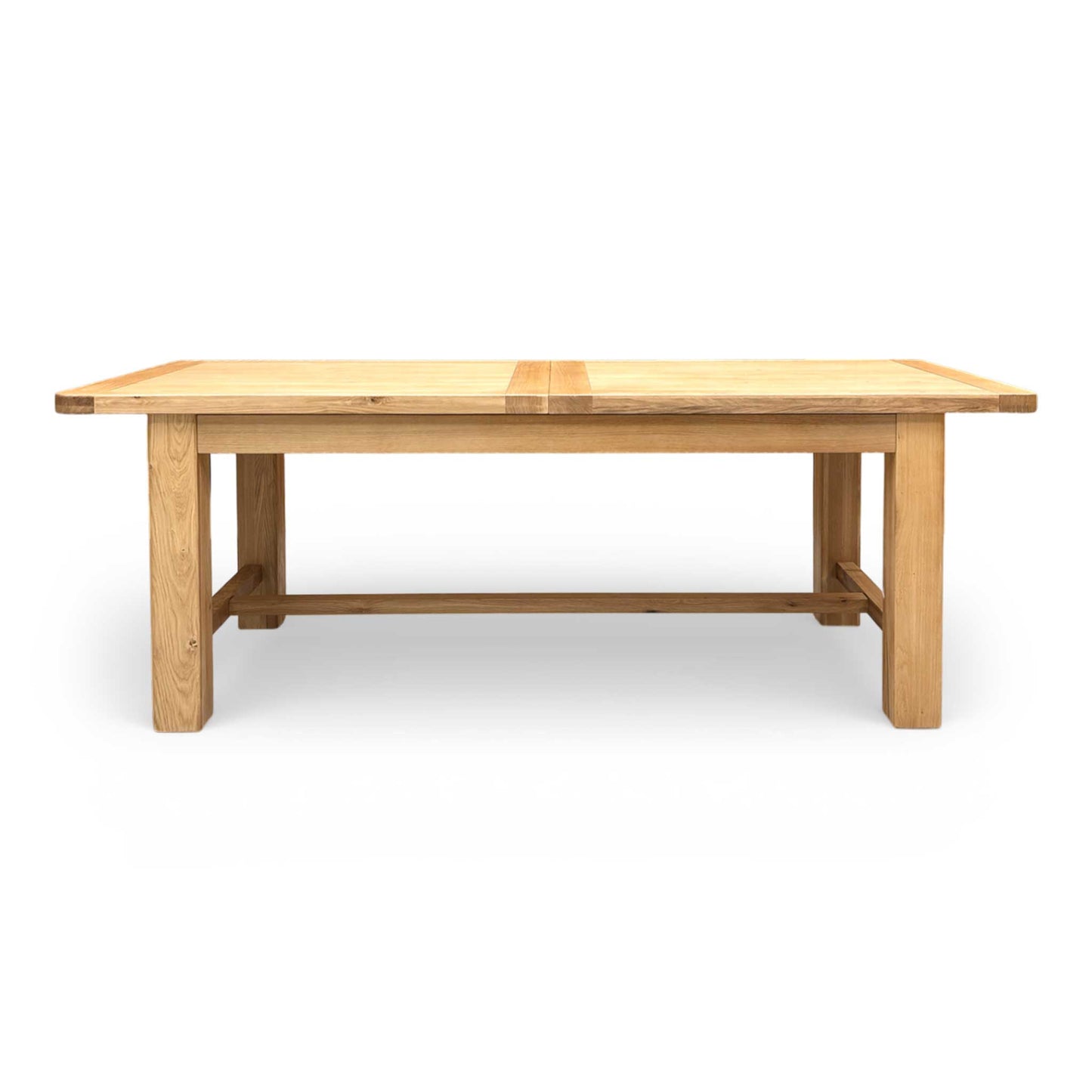 Full view of the Furnitureland ‘Augusta’ Large 220cm Rectangular Extending Dining Table in solid oak, showing its natural wood grain and sturdy construction.