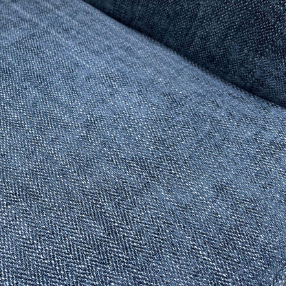 Close-up of the durable navy blue woven fabric upholstery and high-quality stitching on the seat.