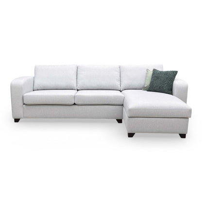Front view of the DFS ‘Layla’ 3 Seater Supreme Sofa Bed in Silver plain fabric, featuring a right-hand facing storage chaise end.