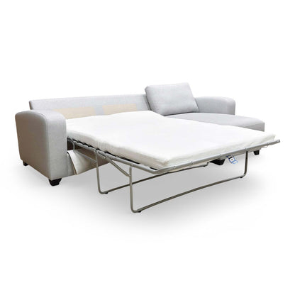 Side profile of the right-hand facing chaise, showing the depth of the seating area and modern silhouette.