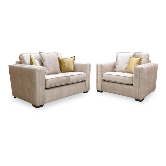 Chelsea beige velvet 2 seater sofa and snuggler chair, angled view with gold scatter cushions