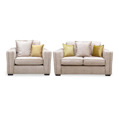 Front view of the Chelsea beige velvet snuggler chair and 2 seater sofa with formal back cushions
