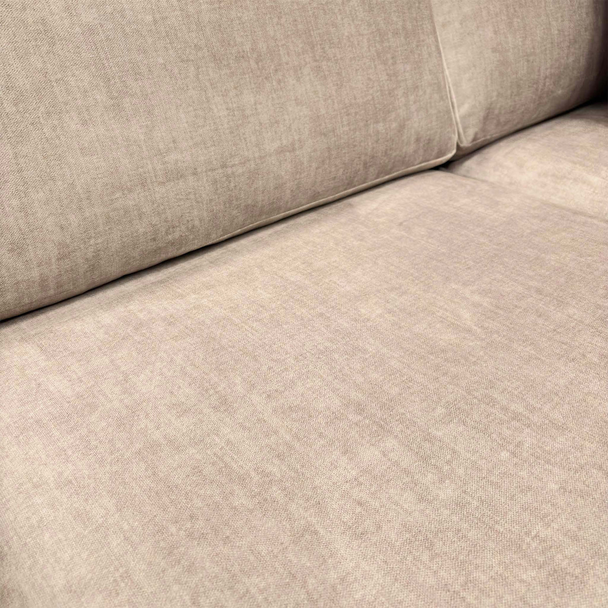 Close-up of the beige vogue velvet fabric used on the Chelsea sofa seat and back cushions