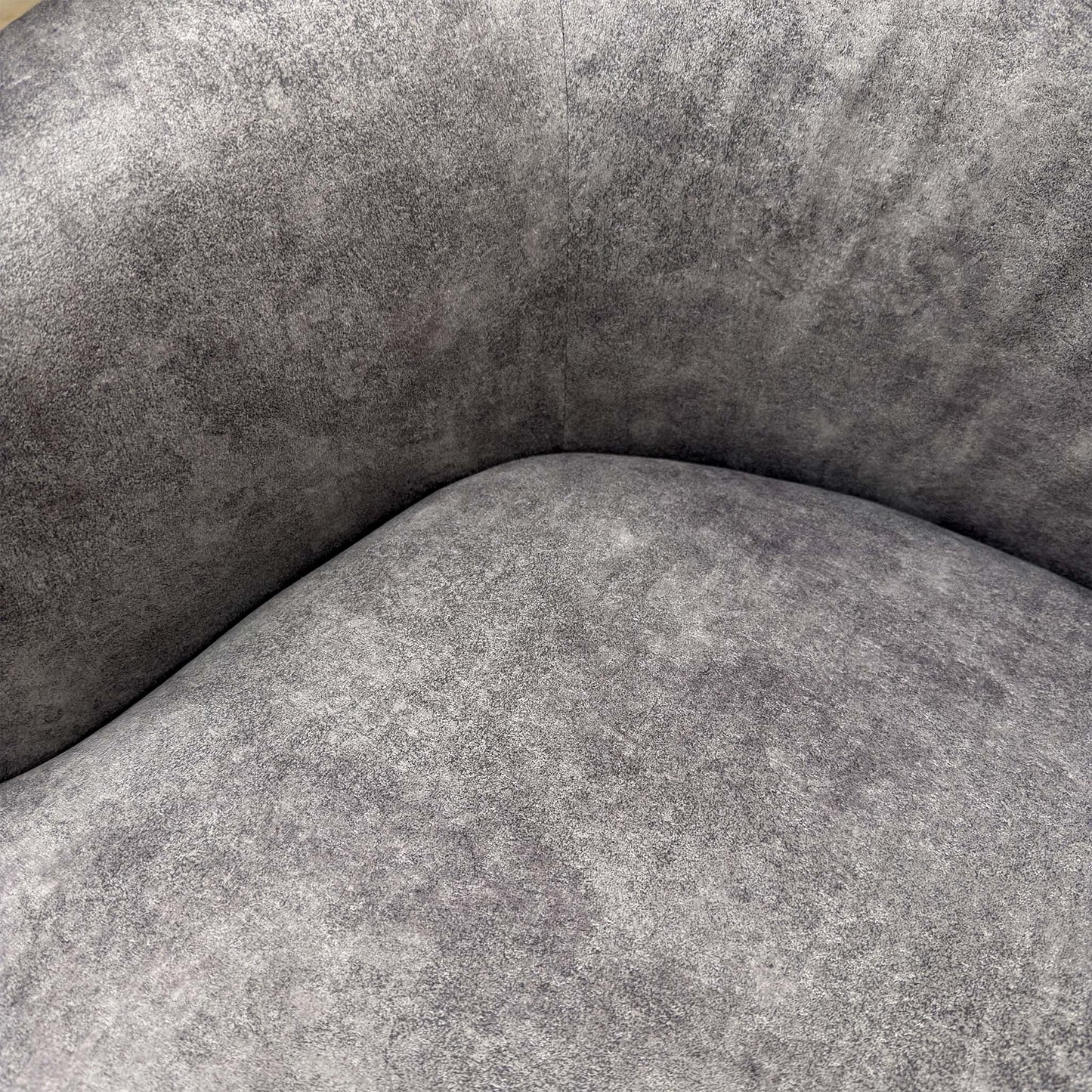 Detailed close-up of the Infinity Silver velvet fabric, illustrating the high-quality sheen, soft texture, and neat stitching of the upholstery.