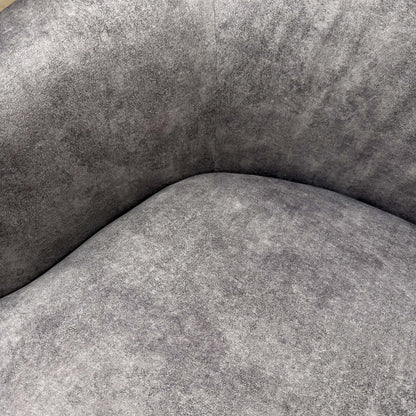 Detailed close-up of the Infinity Silver velvet fabric, illustrating the high-quality sheen, soft texture, and neat stitching of the upholstery.