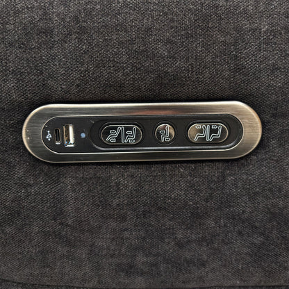Close-up of the integrated power controls and USB charging port on the side of the sofa armrest.