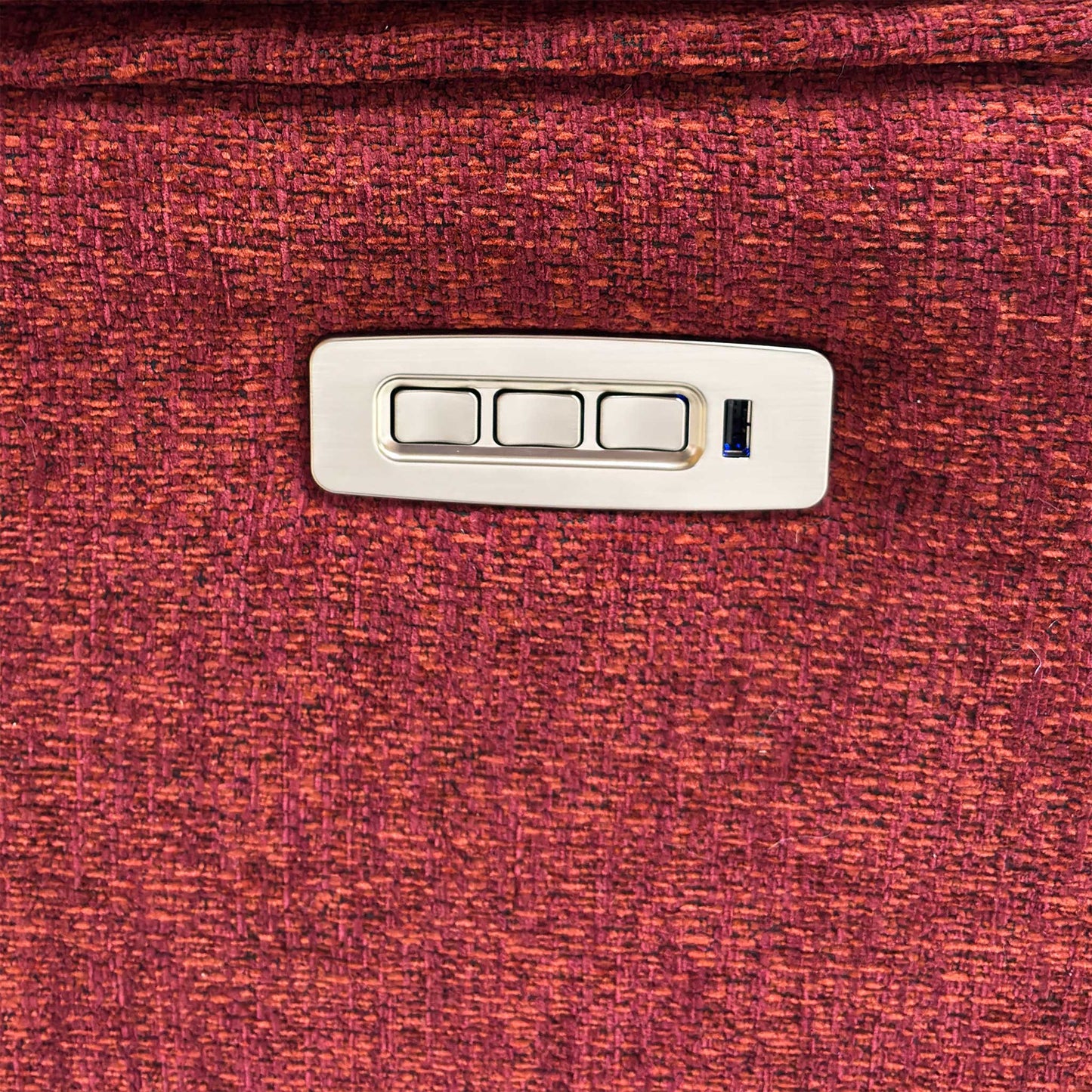 Close-up of the integrated power control panel on the side of the sofa, including buttons for reclining, headrest adjustment, lumbar support, and a USB charging port.