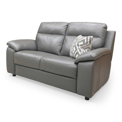 Side profile of the Nicoletti Pepino sofa, emphasizing the clean contemporary lines and the distinctive wide-track arm design.