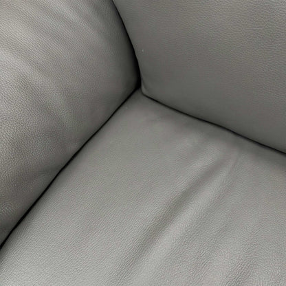 Side profile of the Nicoletti Pepino sofa, emphasizing the clean contemporary lines and the distinctive wide-track arm design.