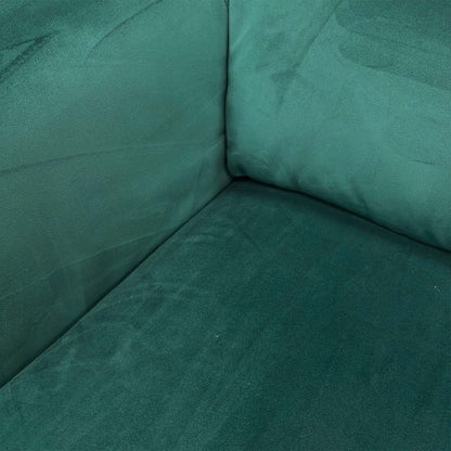 Close-up of the Emerald Green velvet upholstery, highlighting the premium soft-touch texture and the detailed button-back craftsmanship.