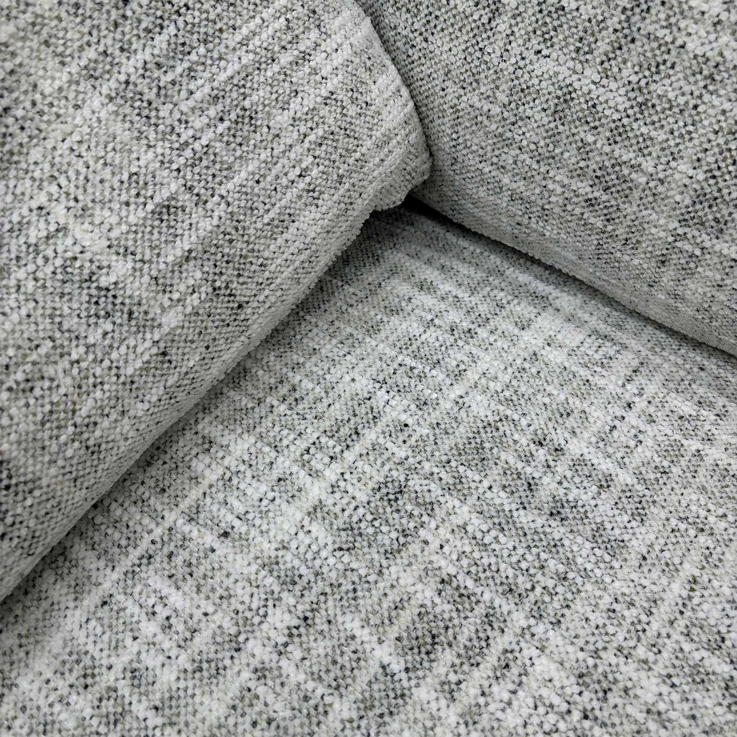 Detailed close-up of the Silver Green fabric and the simple buttoning detail on the backrest, emphasizing the sofa’s understated, elegant look.