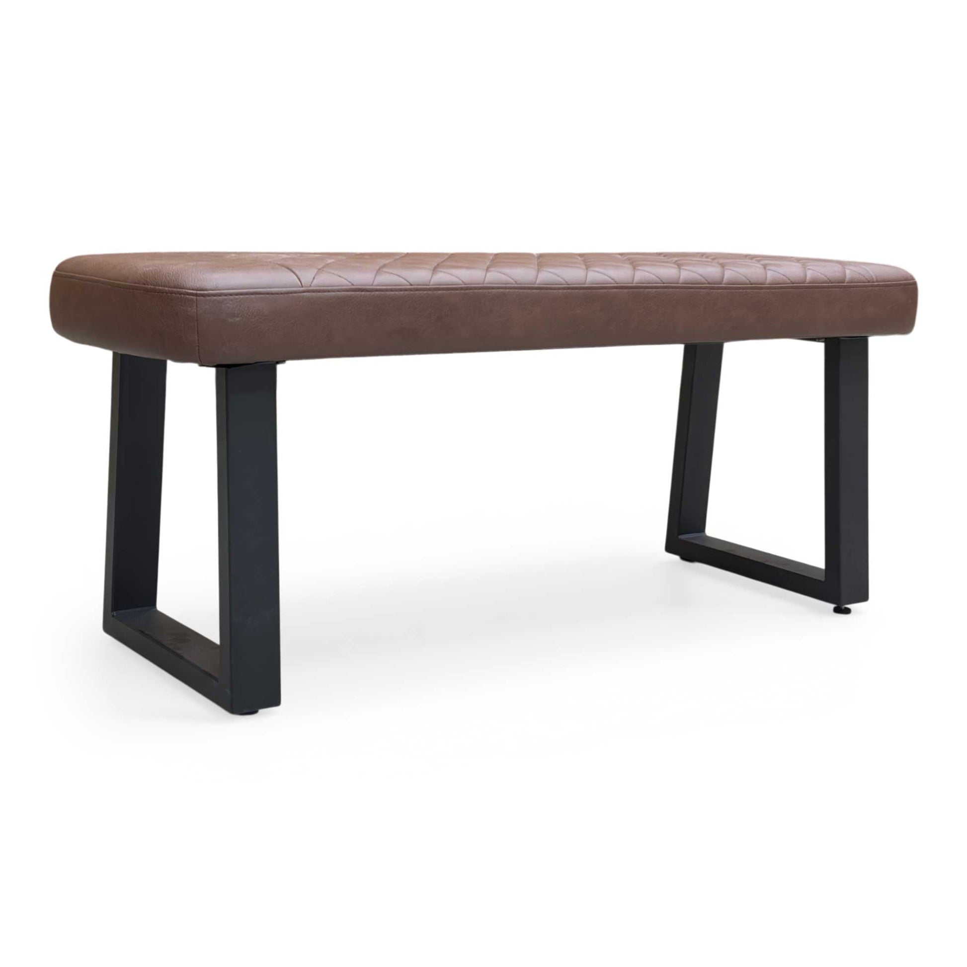 Full view of Furniture Village ‘Venus’ low dining bench upholstered in Tan Faux Leather with industrial black U-shaped metal legs.