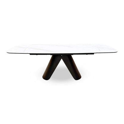 Front view of the Perla dining table featuring a high-gloss grey ceramic top and a modern black pedestal base.