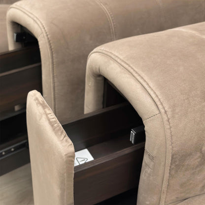Detail view of the open storage compartment built into the sofa’s armrest, perfect for keeping remotes and essentials tucked away.