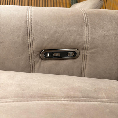 Close-up of the integrated power controls and USB charging port located on the inner arm of the sofa for easy access.