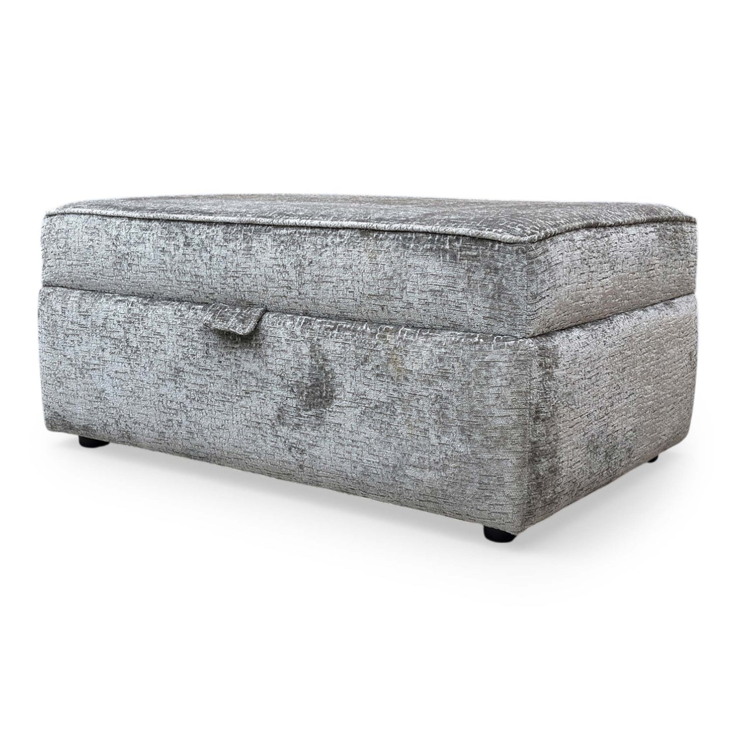 Side profile of the Sasha storage ottoman, emphasizing the clean lines, tailored piping detail, and the sturdy, low-profile base.