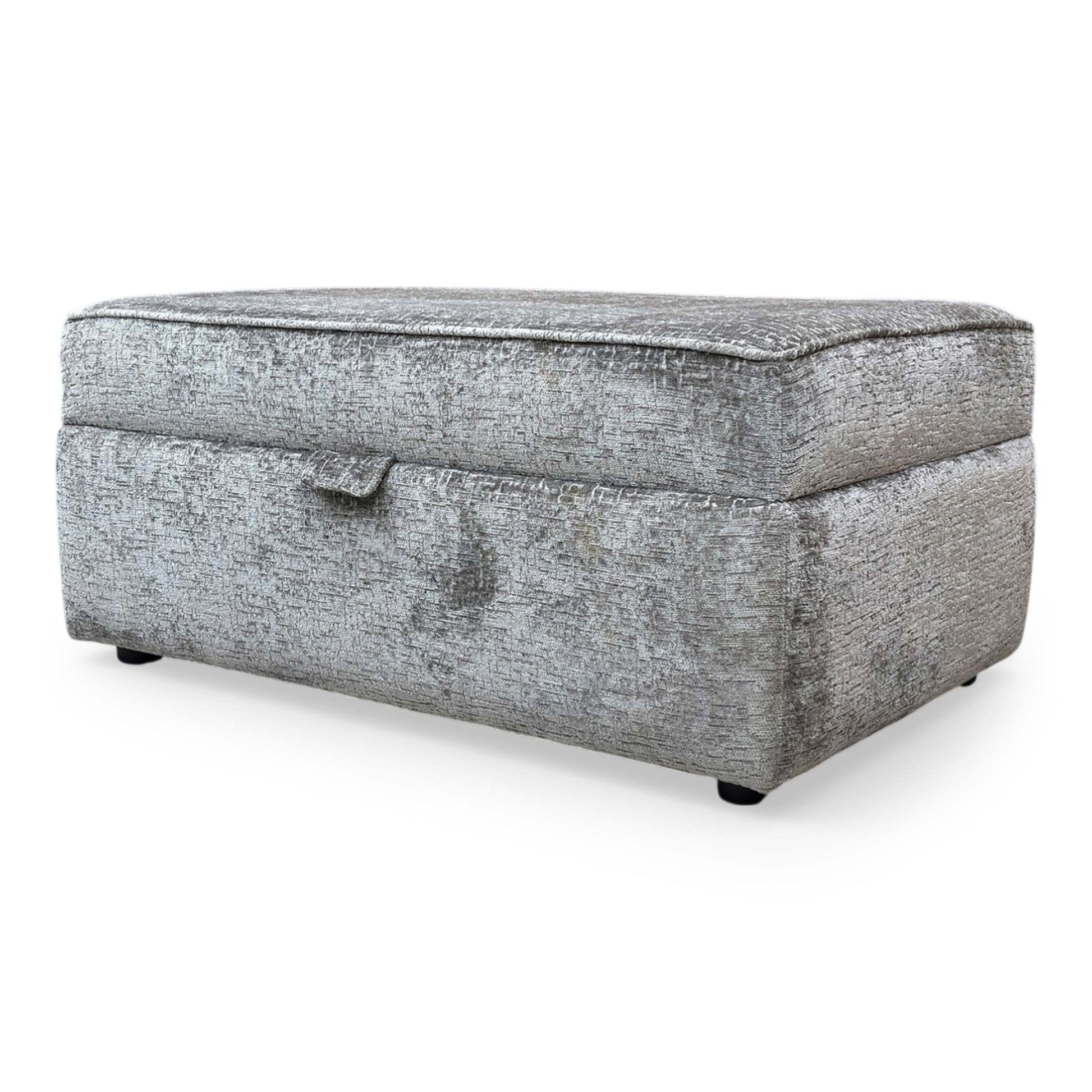 Side profile of the Sasha storage ottoman, emphasizing the clean lines, tailored piping detail, and the sturdy, low-profile base.