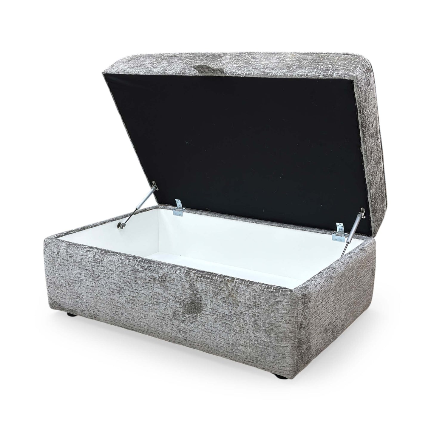 Side profile of the Sasha storage ottoman, emphasizing the clean lines, tailored piping detail, and the sturdy, low-profile base.
