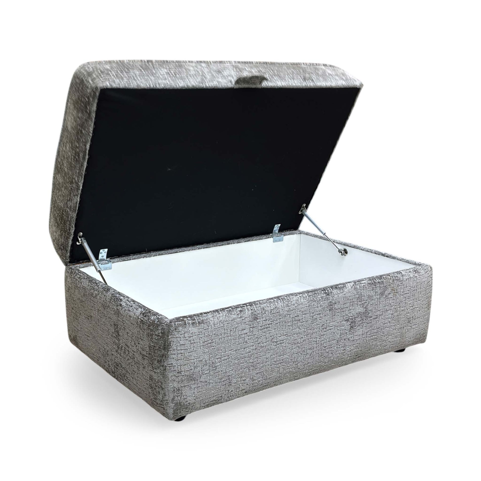 Side profile of the Sasha storage ottoman, emphasizing the clean lines, tailored piping detail, and the sturdy, low-profile base.