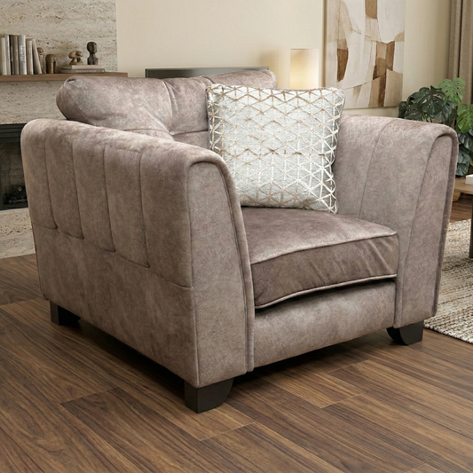 Living room of the Mariah velvet armchair, highlighting its solid hardwood frame, sink-in soft cushions, and durable chocolate-toned fabric.