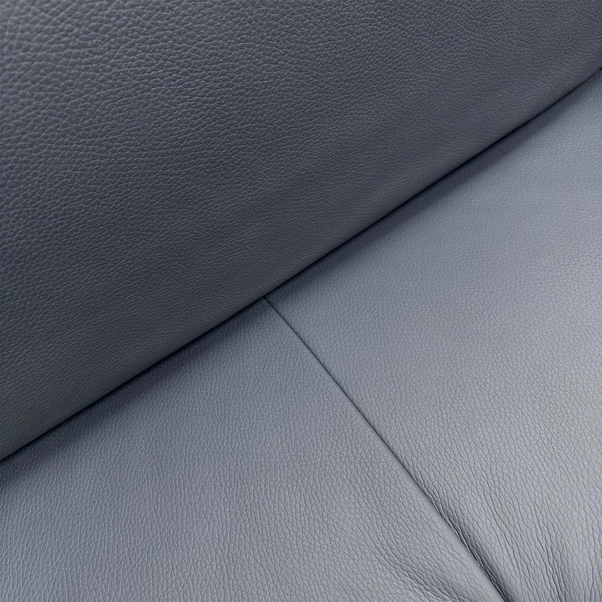 Close-up of the Torello Blu 81 leather upholstery, highlighting the rich navy blue tone, natural grain texture, and high-quality tailored stitching.