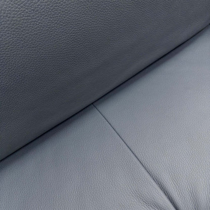 Close-up of the Torello Blu 81 leather upholstery, highlighting the rich navy blue tone, natural grain texture, and high-quality tailored stitching.