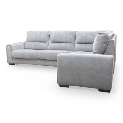 View of the sofa from the back, showing the clean silhouette and uniform fabric finish for open-plan placement.