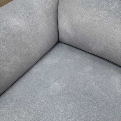 Close-up of the premium smoke velvet upholstery fabric and textured stitching details.