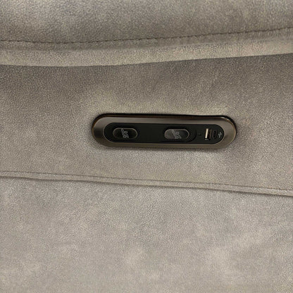 Close-up of the Daytona ‘Dexter’ sofa power reclining buttons with an integrated USB charging port for devices.