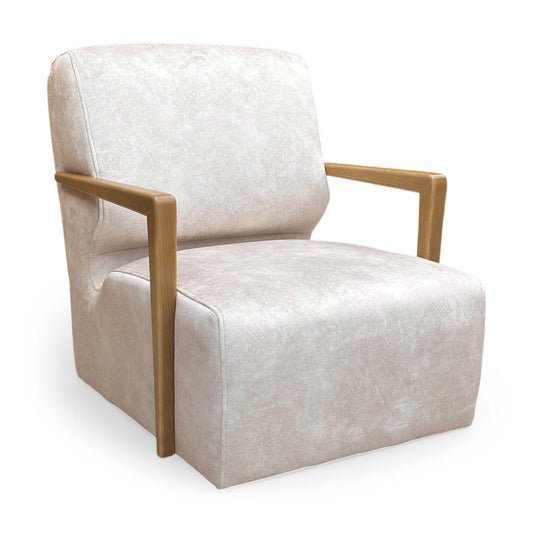 The ‘Aura’ Kenzo Cream Velvet Swivel Chair, featuring a luxurious glam style with exposed dark wood arms and a sturdy swivel base.