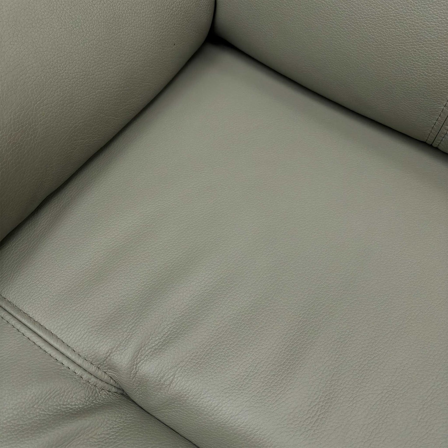Detailed shot of the Cambridge Olive leather grain, showcasing the natural texture and high-quality stitching.