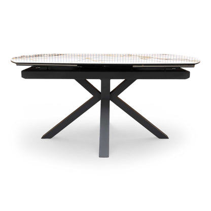 Front view of the ‘Doro’ 160cm extending dining table featuring a premium marble-effect ceramic top and a striking black architectural star-base.