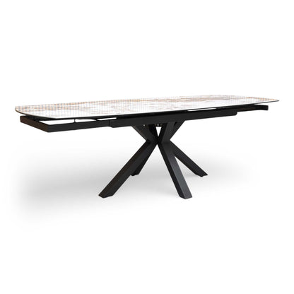 Full view of Furniture Village 'Raul' 160cm extending dining table with a Calcutta marble ceramic top.