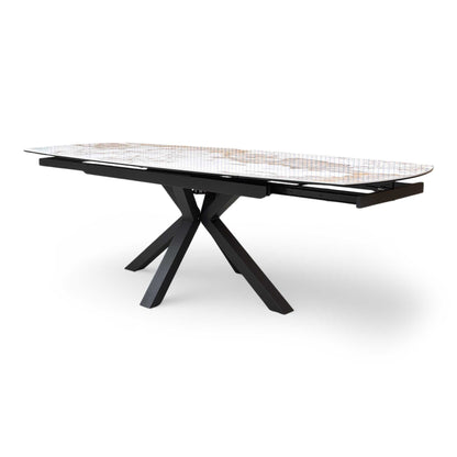 Side profile of the Raul dining table highlighting the curved boat-shaped ceramic top.