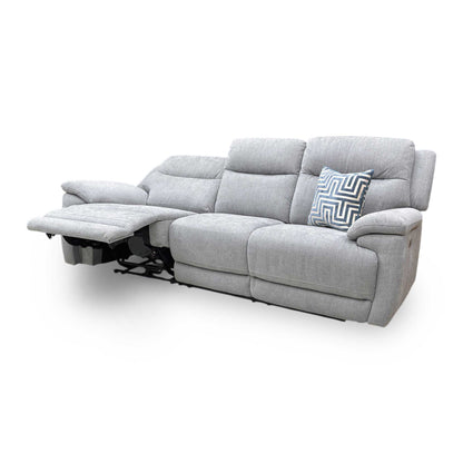 Side profile of the Touch sofa in a fully reclined position, emphasizing the ergonomic lumbar support and the wall-away reclining mechanism.