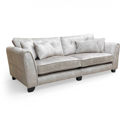Full view of the ‘Mariah Ariana’ 4-seater classic back sofa in Dapple Silver velvet, featuring a grand silhouette, elegant curved arms, and sophisticated dark wooden feet.