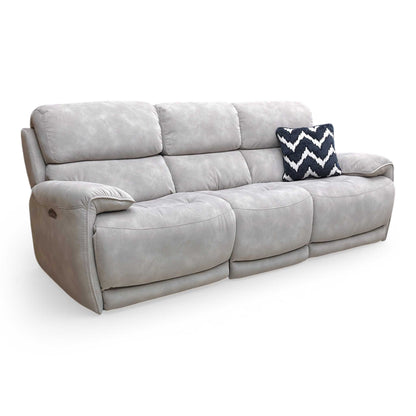 Side shot of the integrated power control panel, showing the metallic buttons for reclining and headrest functions along with a built-in USB charging port.