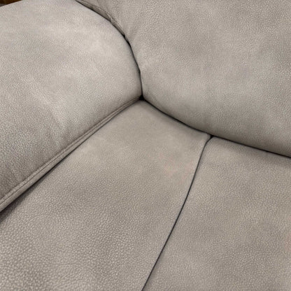 Close-up of the Silver fabric upholstery, highlighting the durable woven texture, subtle sheen, and high-quality contrast stitching.