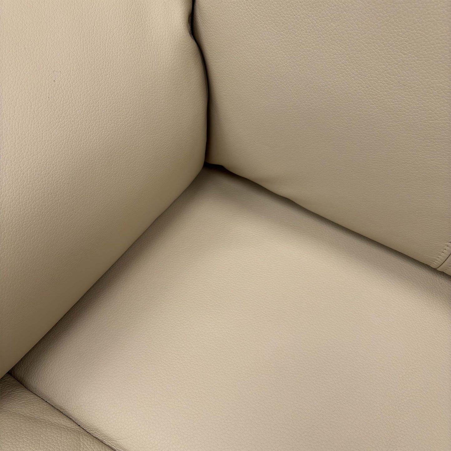 Close-up of the Cambridge Stone leather, highlighting the natural grain texture, soft-touch finish, and high-quality tailored stitching.