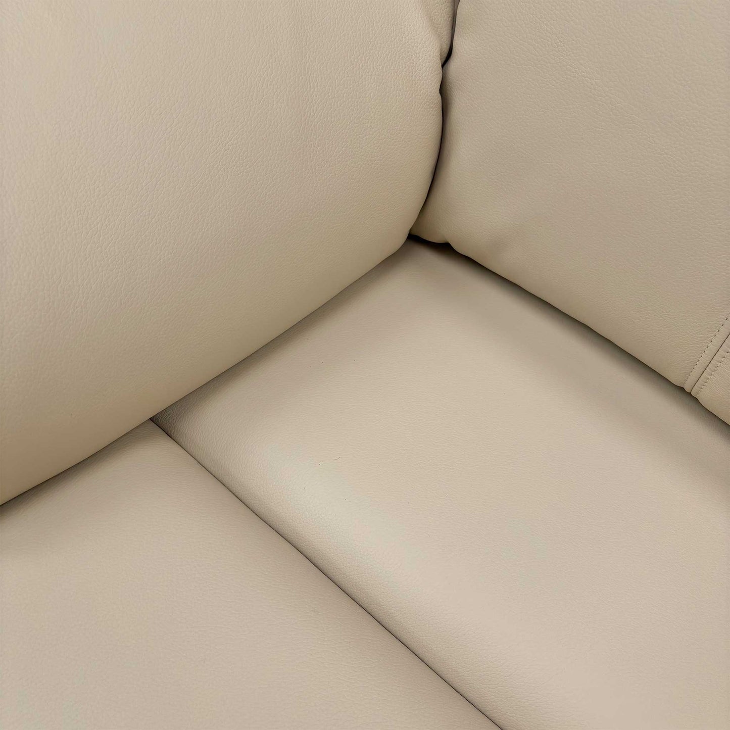 Close-up of the Cambridge Stone (L843) leather upholstery, highlighting the premium natural grain, soft-touch texture, and precision tonal stitching.